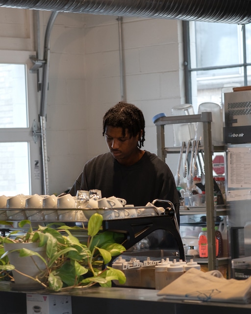 Micah behind the espresso machine at Watson