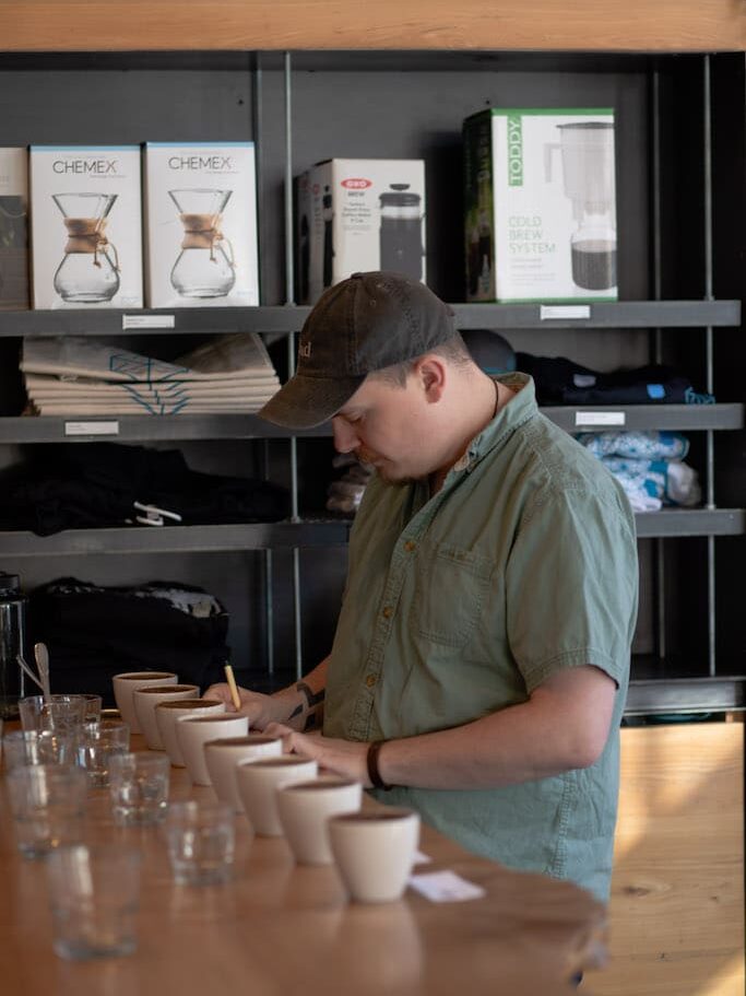 Alex cupping A barista cups coffee at the cupping table at Blueprint Coffee.