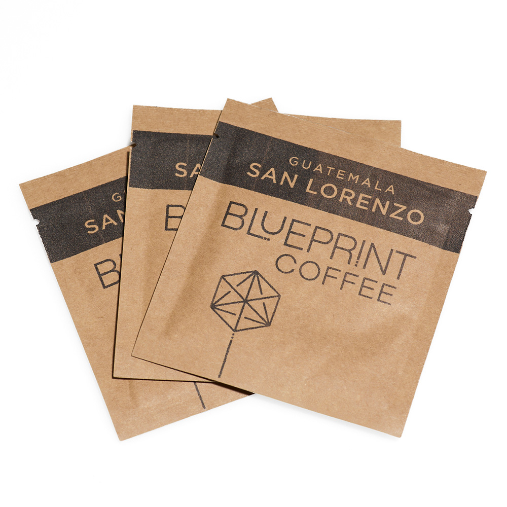 Three brown sachets of San Lorenzo, Guatemala instant coffee roasted by Blueprint Coffee.