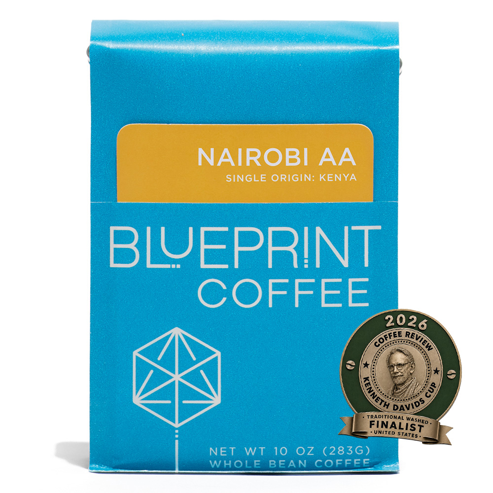 A blue 10-ounce bag of Nairobi AA, Kenya coffee beans featuring the Blueprint Coffee Logo and a yellow removable info card. A badge placed over the image indicates that the coffee is a finalist in the 2026 Kenneth Davids Cup in the Traditional Washed category.
