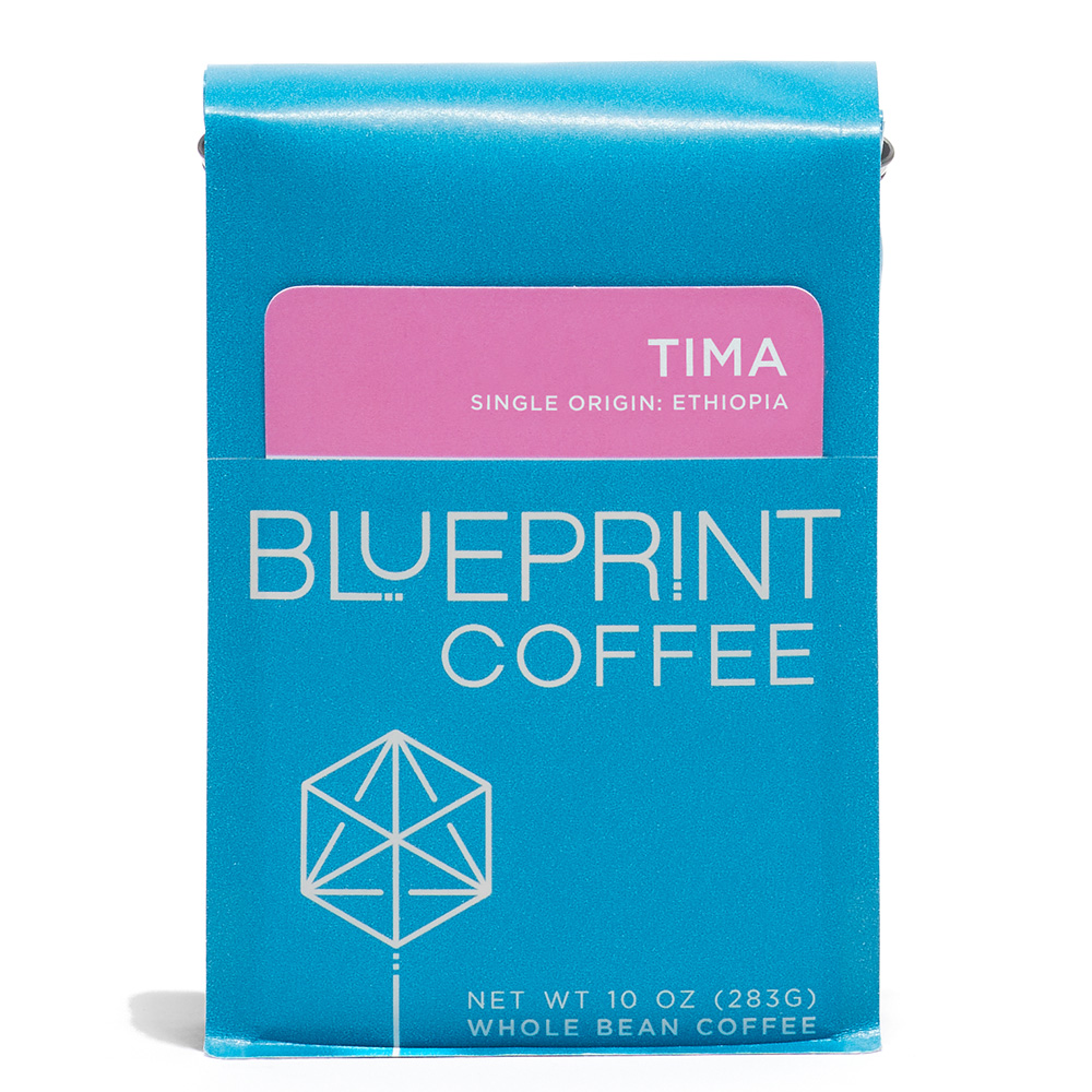 A blue 10-ounce bag of Tima, Ethiopia coffee beans featuring the Blueprint Coffee Logo and a pink removable info card.